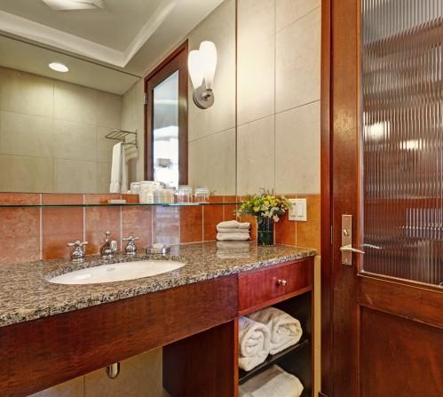 All of our guestroom bathrooms have plenty of counter space for your toiletries, and a lighted make-up mirror!