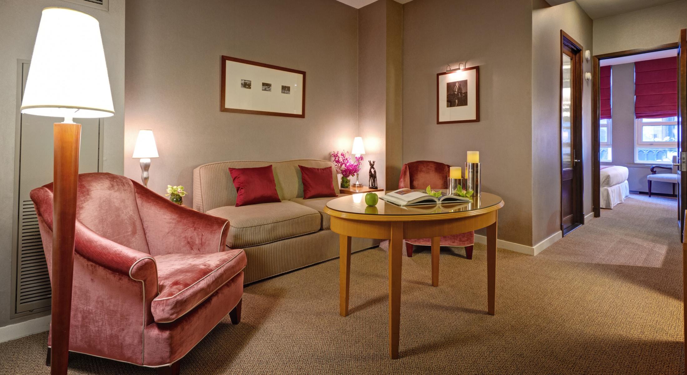 The living room in our Classic King Suite offers a tranquil space for you to relax during your visit to Hotel Giraffe